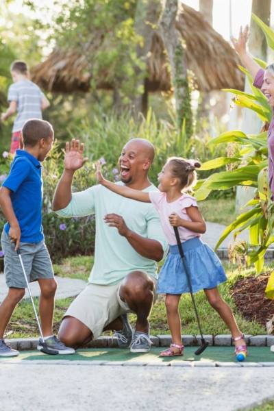 Fun Golf Experience at Spring Rock Golf – Family-friendly Entertainment in New Hyde Park, NY Family enjoying Fun Golf at Spring Rock Golf, New Hyde Park, NY – Virtual targets and shot tracking for all skill levels